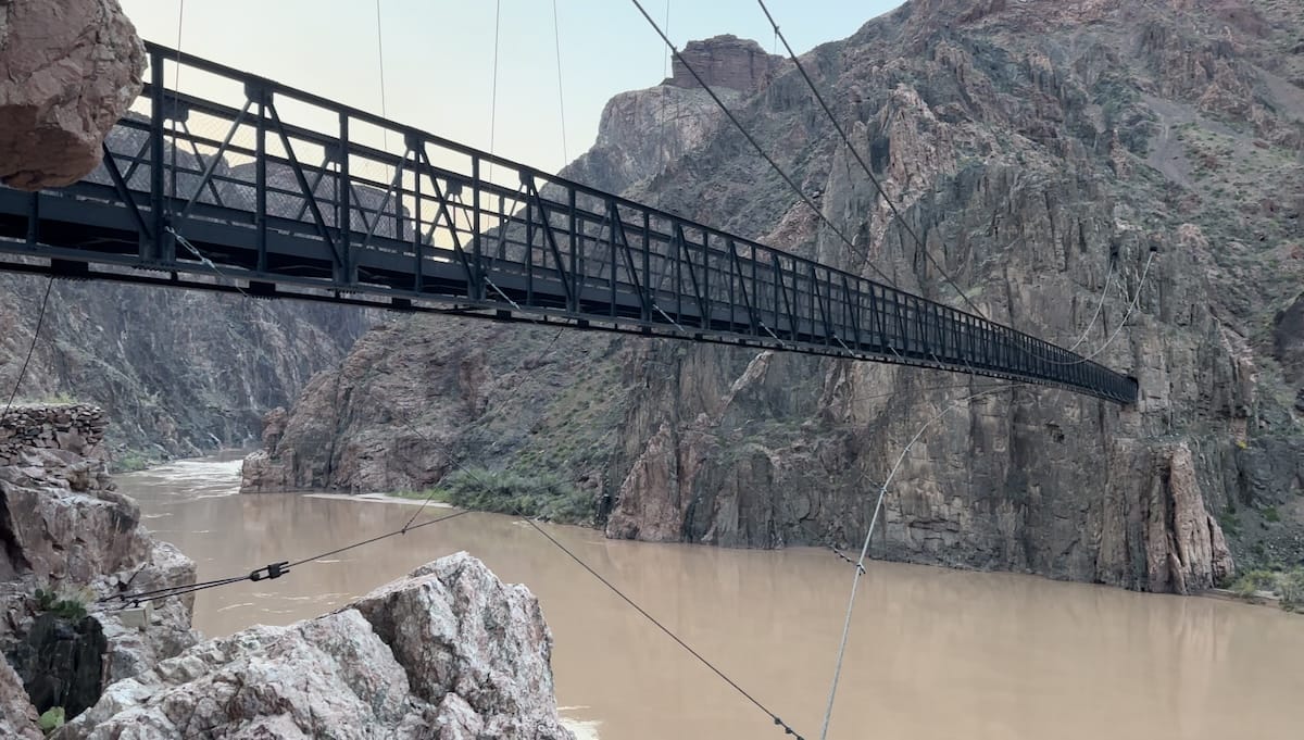 grand-canyon-black-bridge-colorado-river Black suspension bridge crossing the Colorado River in the Grand Canyon.