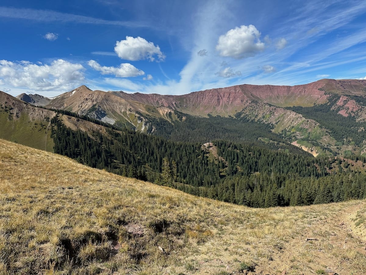 Mountain ridge view with forest valley on Capitol Peak Trail.