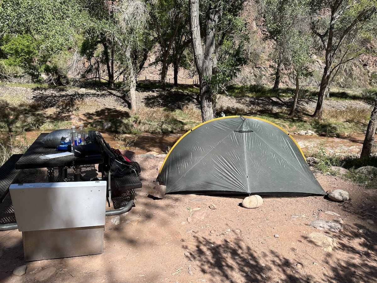 phantom-ranch-campsite-grand-canyon-tent Campsite at Phantom Ranch in Grand Canyon National Park with a green Tarptent Rainbow, picnic table, and bear box.