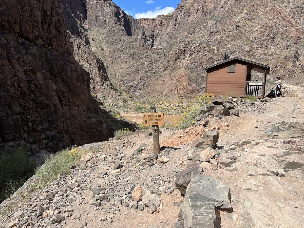 phantom-ranch-pipe-creek-beach-trail Trail sign at Phantom Ranch pointing to Phantom Ranch and Pipe Creek Beach in Grand Canyon National Park.
