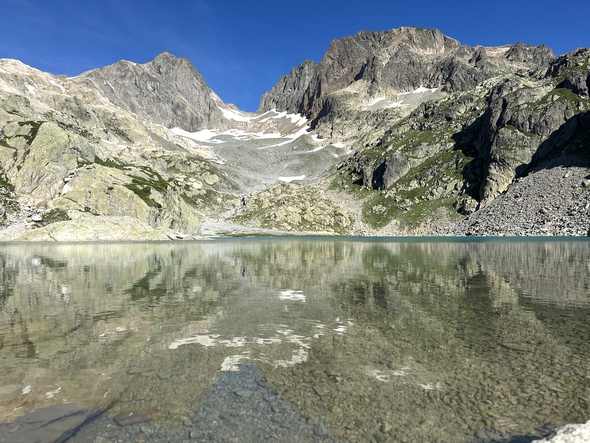 Lac Blanc alpine lake with mountain reflection.