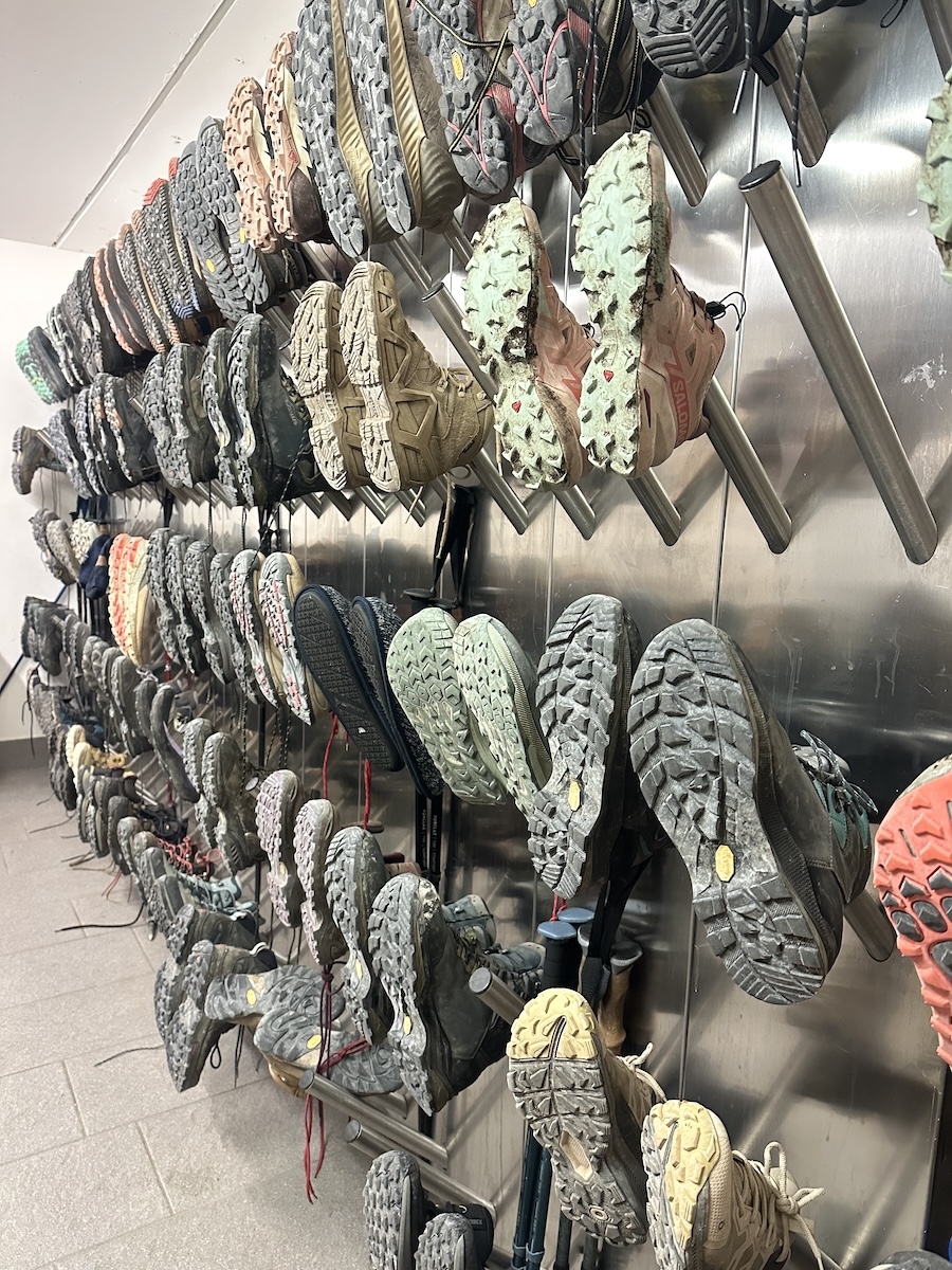 Wall of hiking boots drying at rifugio Alta Via 1
