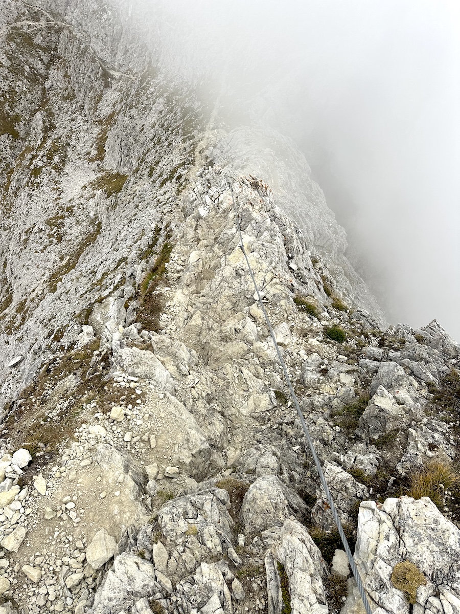 Narrow rocky ridge with cable protection Alta Via 1 by Rifugio Nuvolau