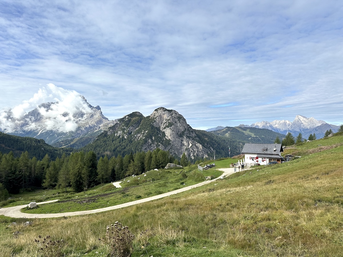 Mountain hut in valley with Dolomite backdrop