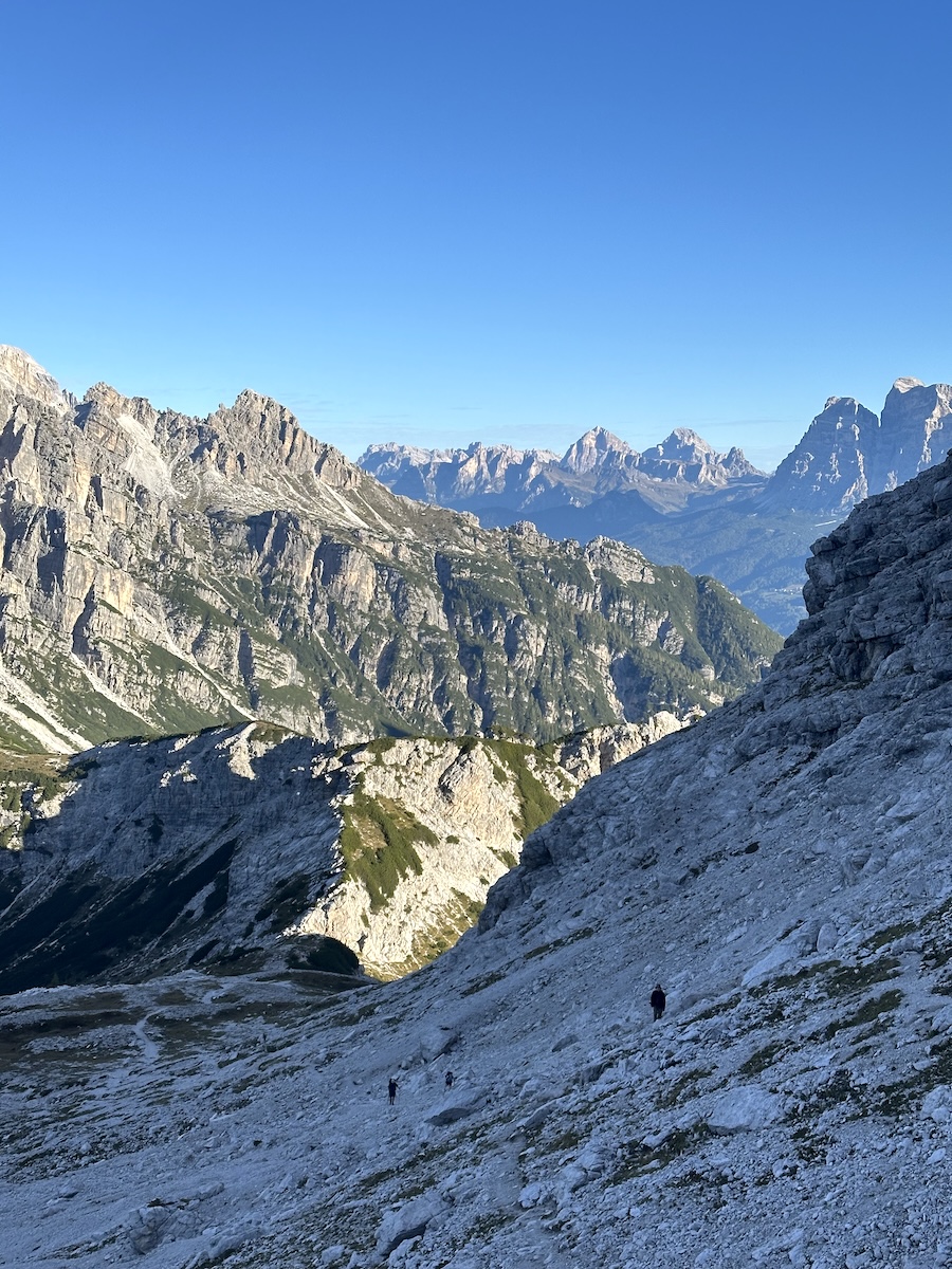 Backpackers climbing ridge to Cima di Zita on Alta Via 1