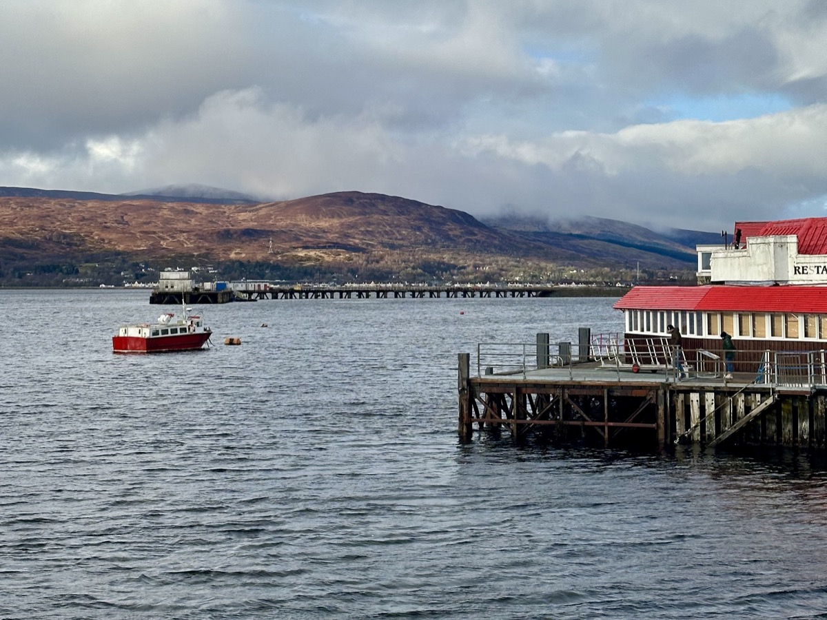 Loch Linnhe pier and red boat at Fort William after completing the West Highland Way