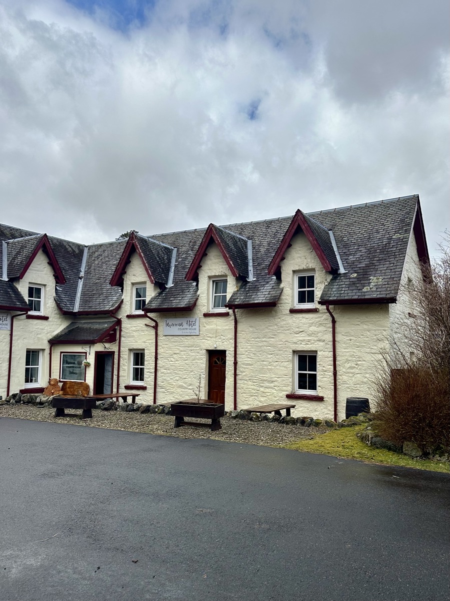 Exterior of Inveroran Hotel on the West Highland Way with whitewashed walls and slate roof