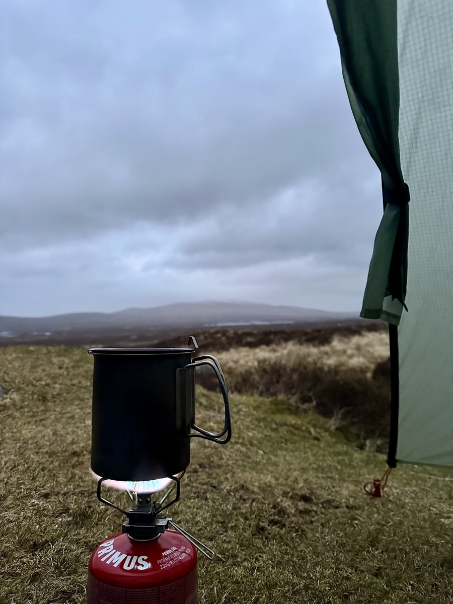Snowpeak GigaPower 2.0 stove boiling water outside a Tarptent Rainbow on a wild camp on Rannoch Moor on the West Highland Way