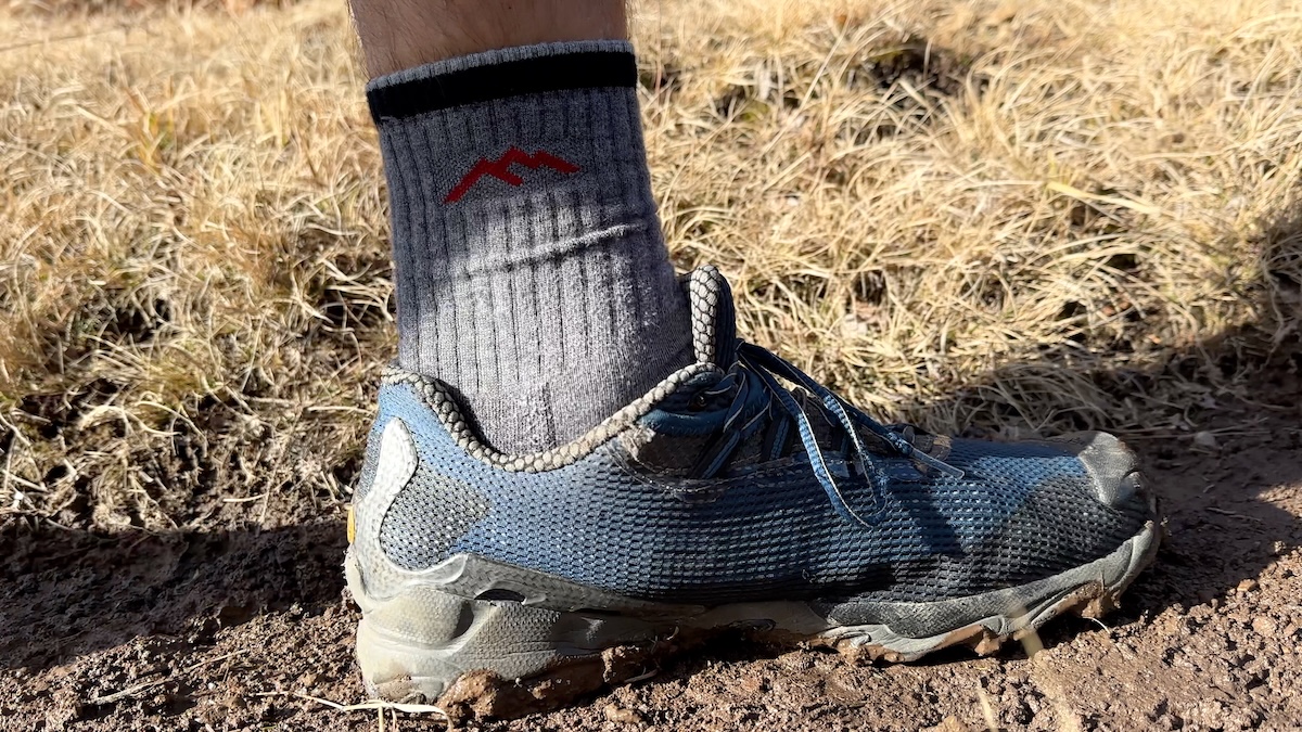 trail-runner-darn-tough-sock-dirt-trail Trail runners and Darn Tough socks for hiker foot care.