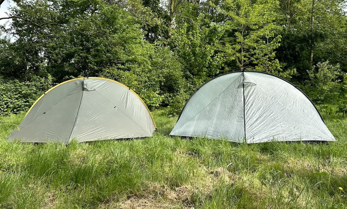 Tarptent Rainbow polysil version on the left and Tarptent Rainbow Li DCF on the right pitched side by side in a green field