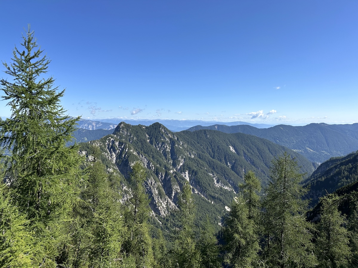 slemenova-spica-view-southeast-ridges Forested ridges and distant peaks seen from the Slemenova Špica plateau.
