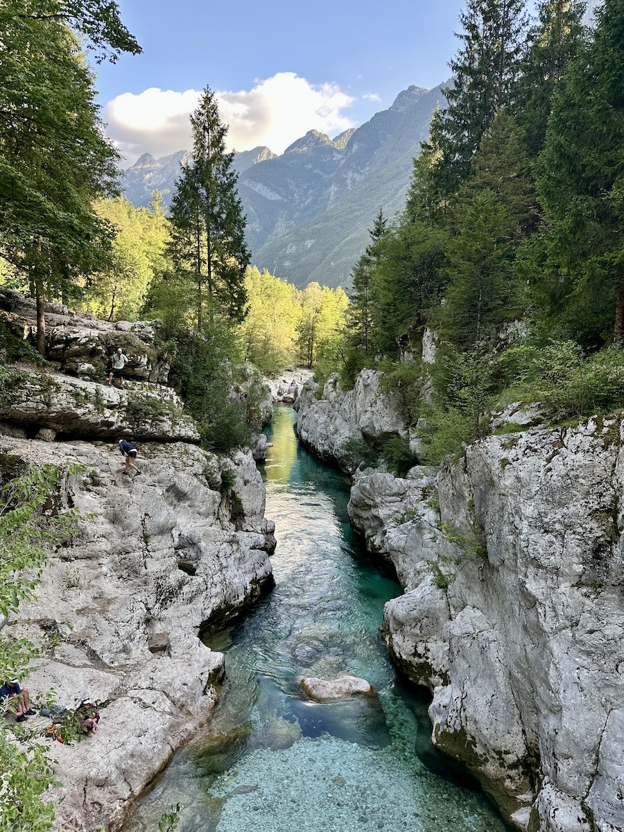 soca-gorge-from-footbridge-velika-korita Looking down the Soča River gorge from the footbridge at Velika Korita, with the Julian Alps behind.