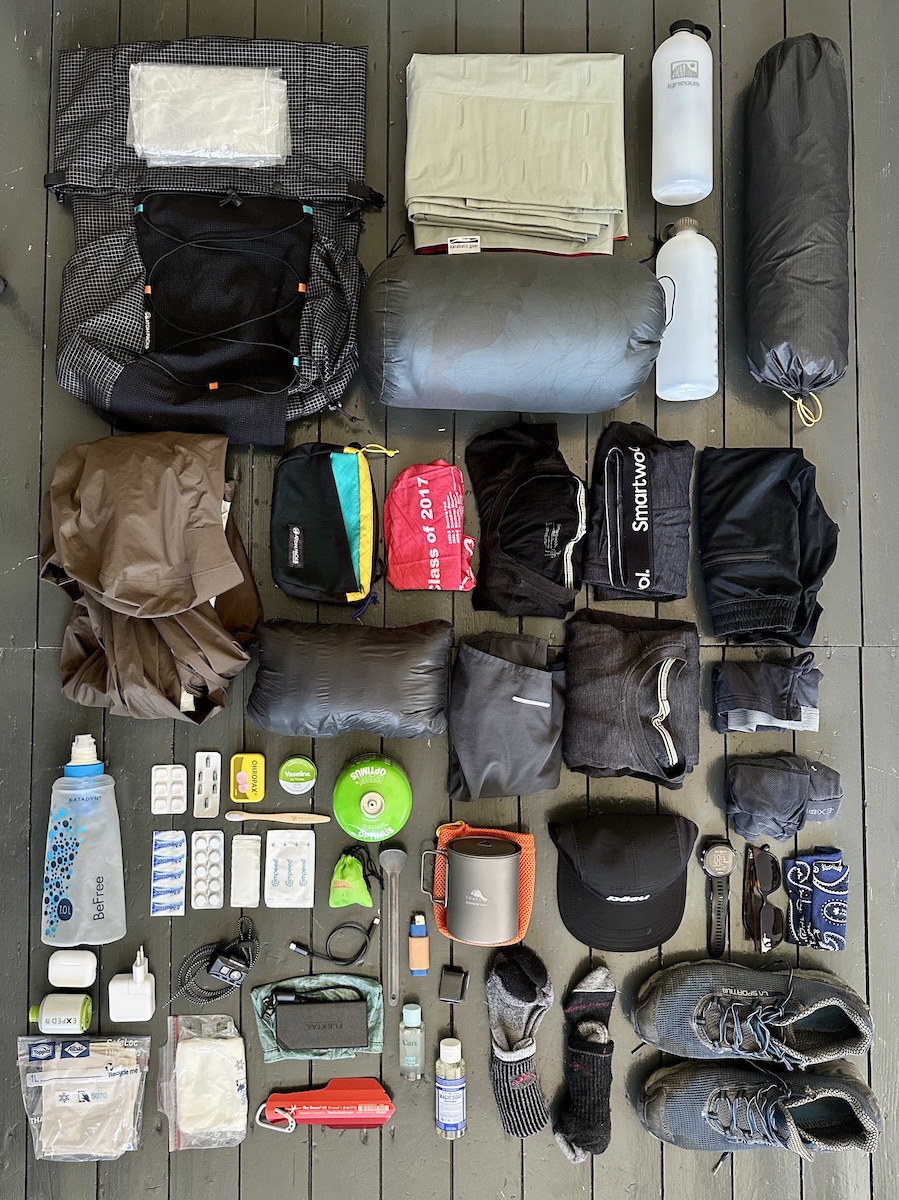 Peaks of the Balkans gear list laid out: Atom Packs backpack, sleeping bag, shelter, stove, clothing and La Sportiva trail runners